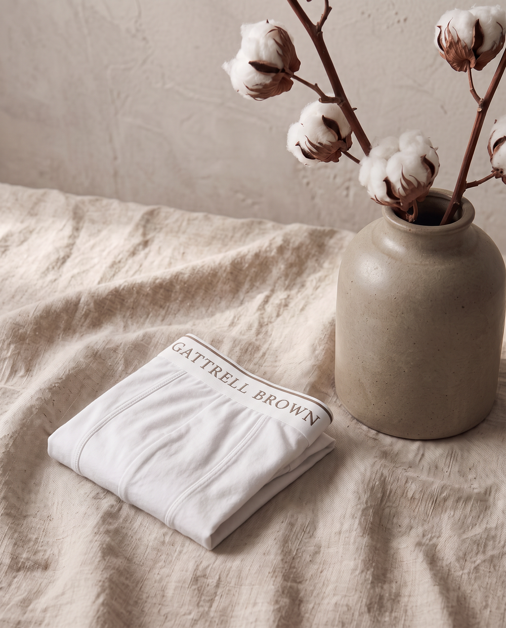 White cotton underwear folded on linen
